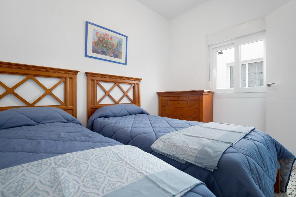 A bed or beds in a room at Casa Mela