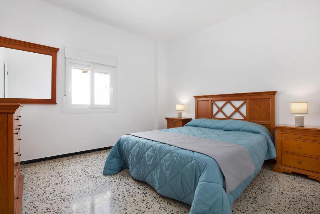 A bed or beds in a room at Casa Mela