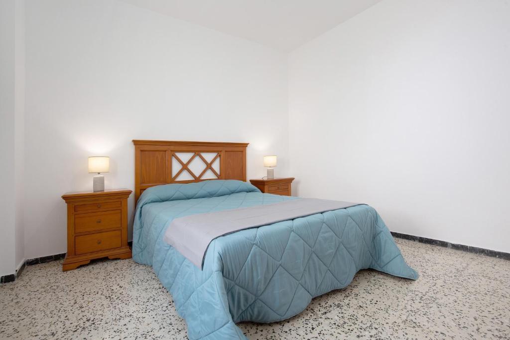 A bed or beds in a room at Casa Mela