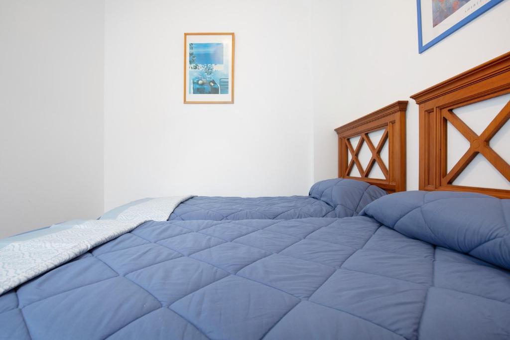 A bed or beds in a room at Casa Mela