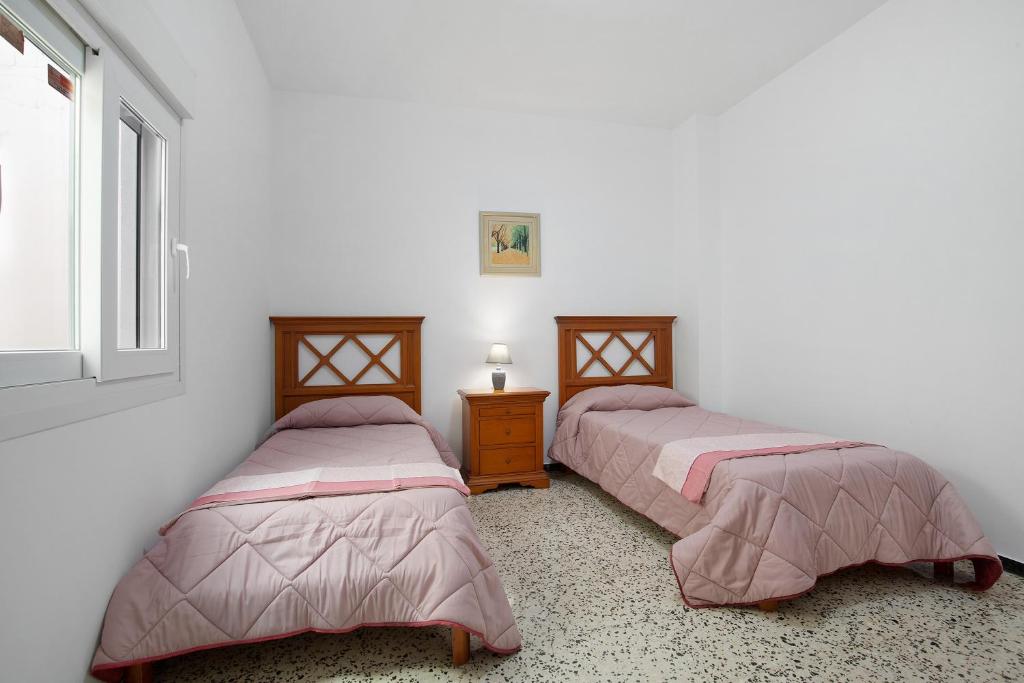 A bed or beds in a room at Casa Mela