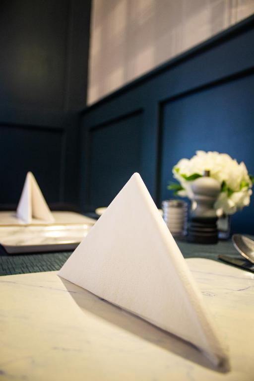 a white napkin sitting on top of a table at Kintrae B&B in Buckie
