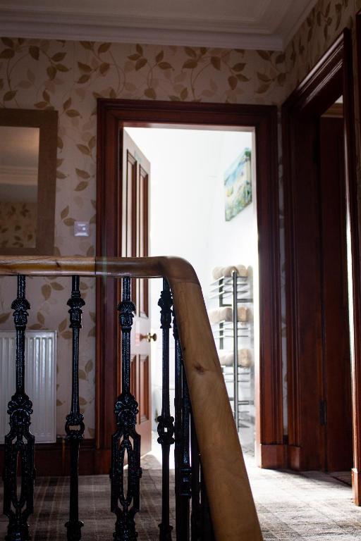 a staircase in a room with a sliding glass door at Kintrae B&B in Buckie