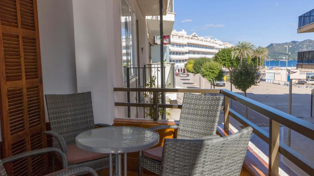 a balcony with a table and chairs and a view of a street at Vives Ref 9002 in Cala Bona