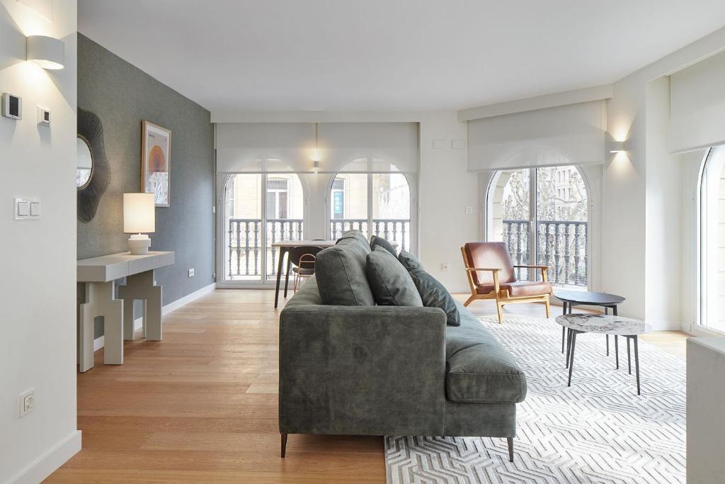 a living room with a couch and a table at The Rentals Collection - Olabar II in San Sebastián