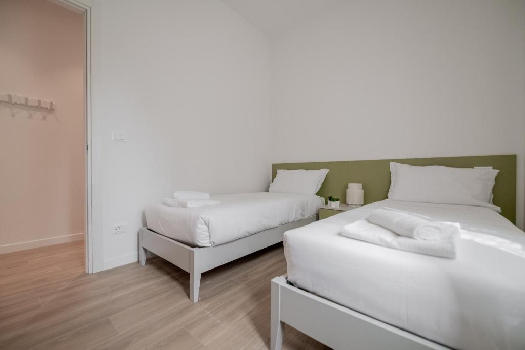 A bed or beds in a room at Realkasa La Pigna Flat