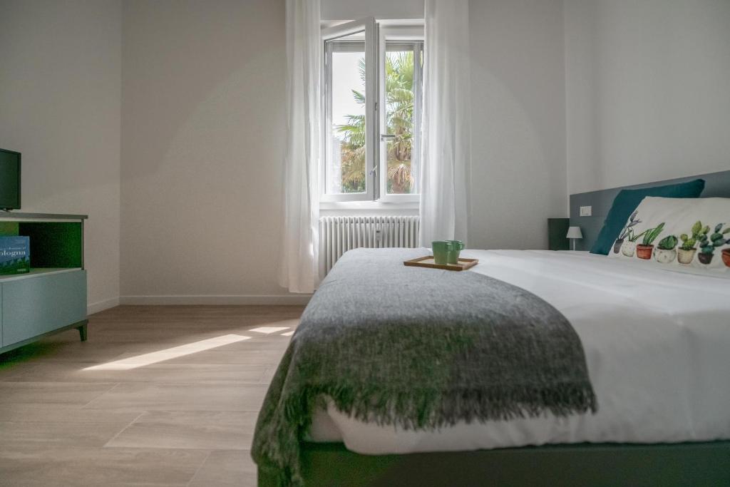 A bed or beds in a room at Realkasa La Pigna Flat