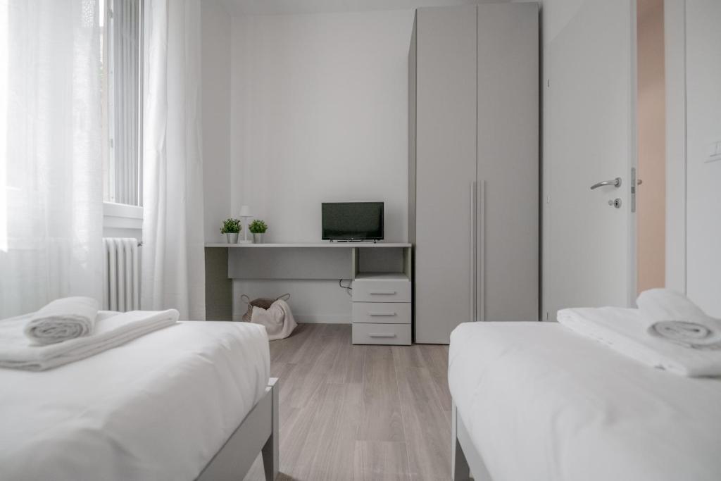 A bed or beds in a room at Realkasa La Pigna Flat