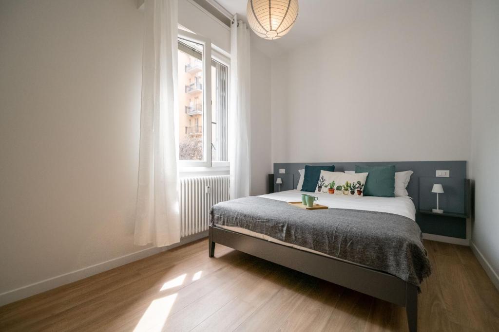 A bed or beds in a room at Realkasa La Pigna Flat