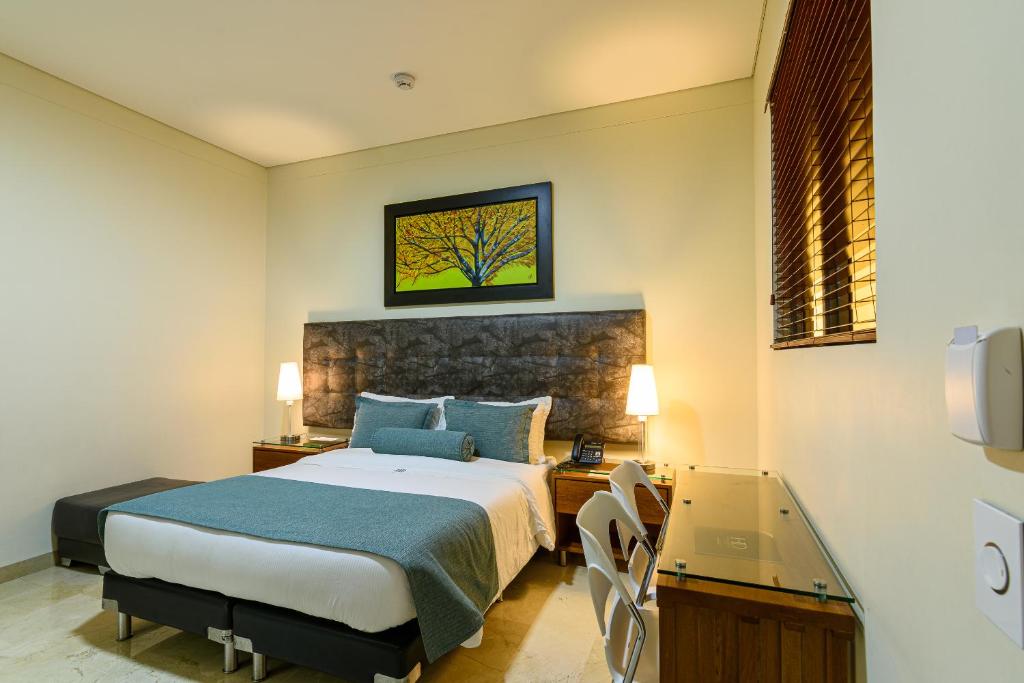 Postel nebo postele na pokoji v ubytování Hotel Dorado La 70