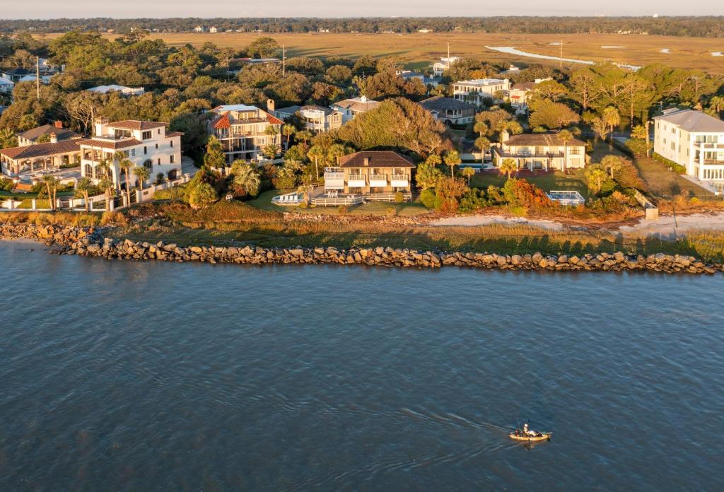 an aerial view of a house and a boat in the water at This is It - 4314 Sixteenth Street in Saint Simons Island