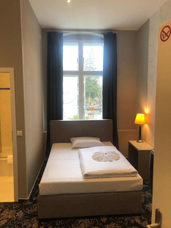 Postel nebo postele na pokoji v ubytování Hotel Gasteiner Hof
