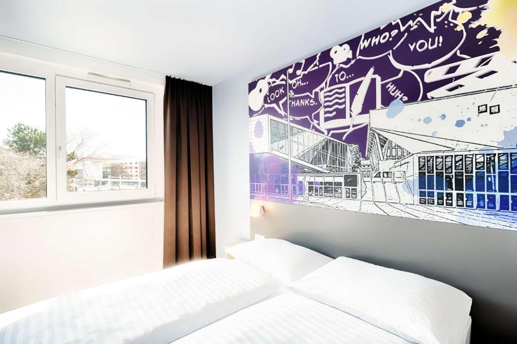 Łóżko lub łóżka w pokoju w obiekcie B&B Hotel Wien-Stadthalle