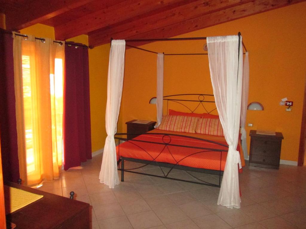 Postel nebo postele na pokoji v ubytování B&B Le Terrazze Isola Di S. Antioco