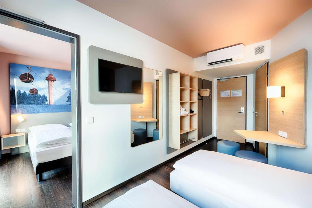 Postel nebo postele na pokoji v ubytování B&B Hotel Willingen