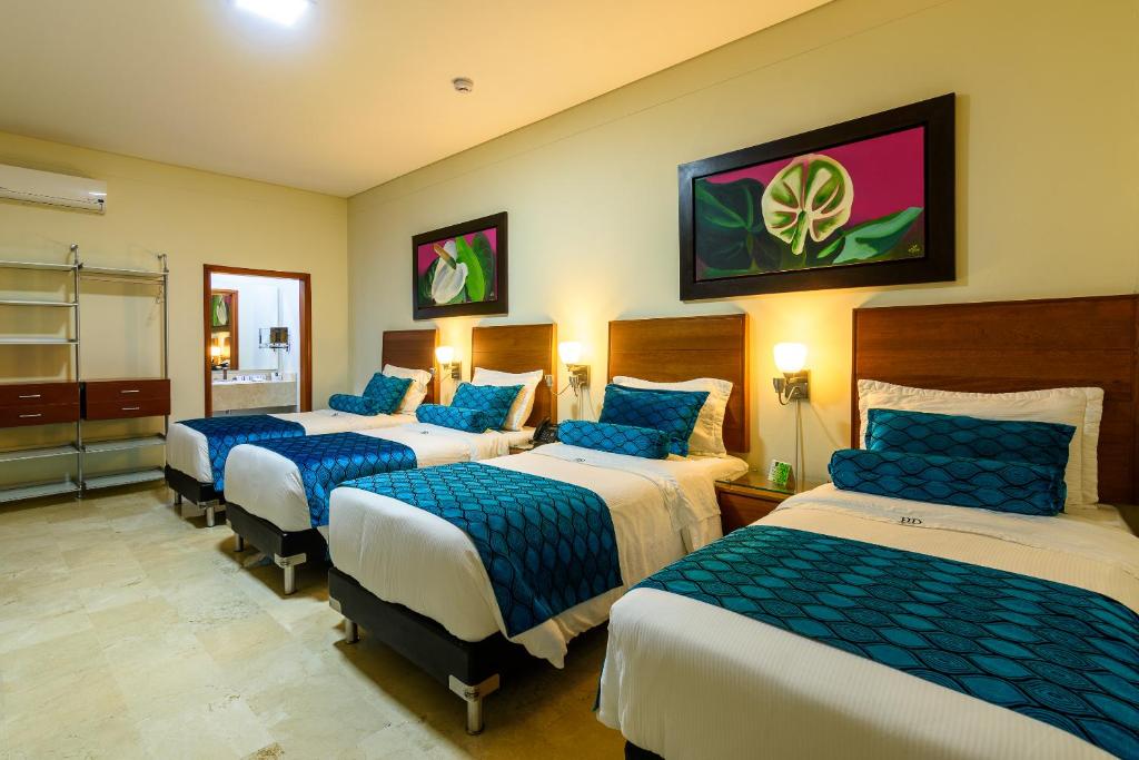 Postel nebo postele na pokoji v ubytování Hotel Dorado La 70