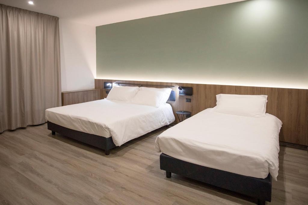 Postel nebo postele na pokoji v ubytování Moody smart & comfy Hotel