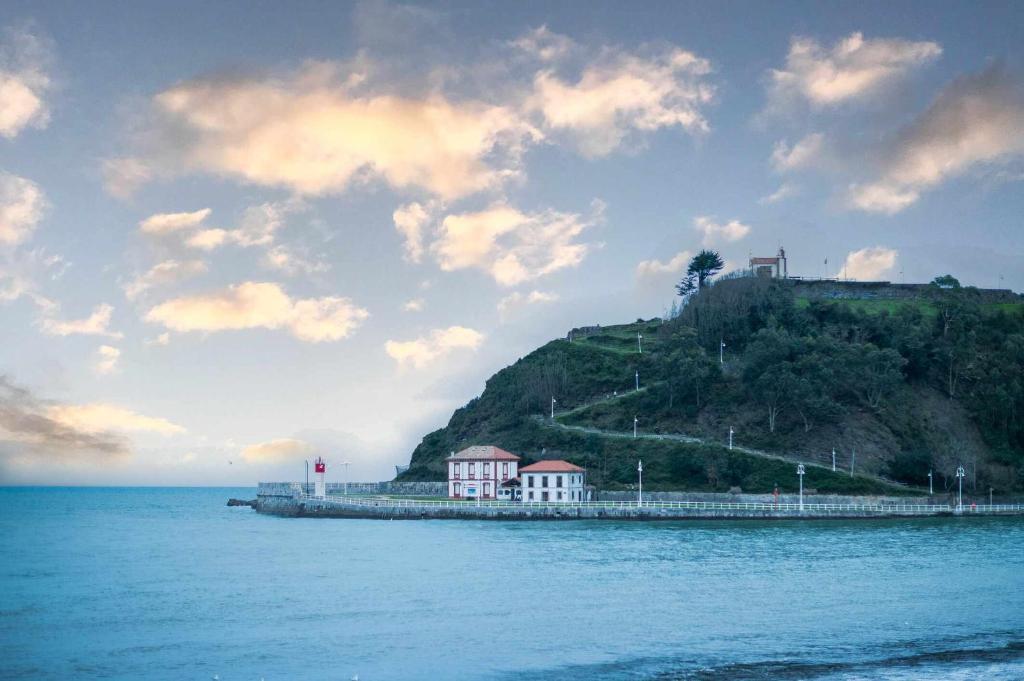 a small island in the middle of the water at Apartamento Playa Sella in Ribadesella