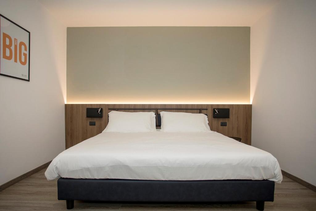 Postel nebo postele na pokoji v ubytování Moody smart & comfy Hotel