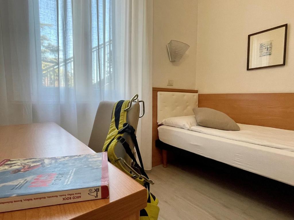 Postel nebo postele na pokoji v ubytování Hotel Garden Arco