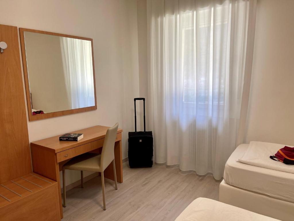 Postel nebo postele na pokoji v ubytování Hotel Garden Arco