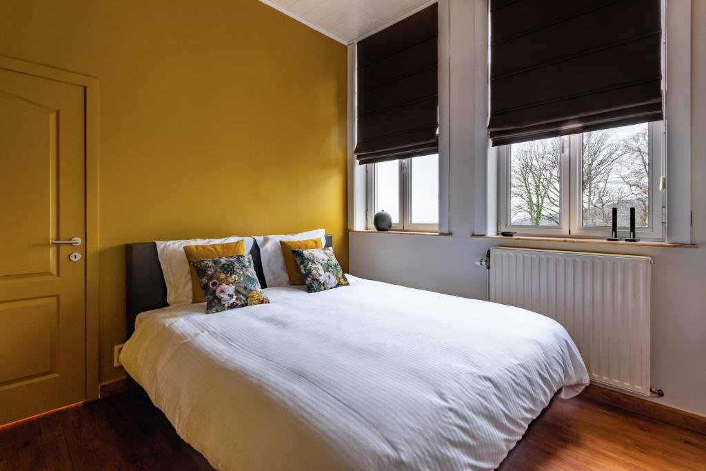 Postel nebo postele na pokoji v ubytování Boeckhaege vakantiewoning