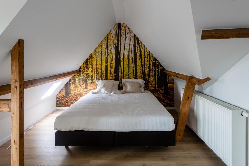 Postel nebo postele na pokoji v ubytování Boeckhaege vakantiewoning