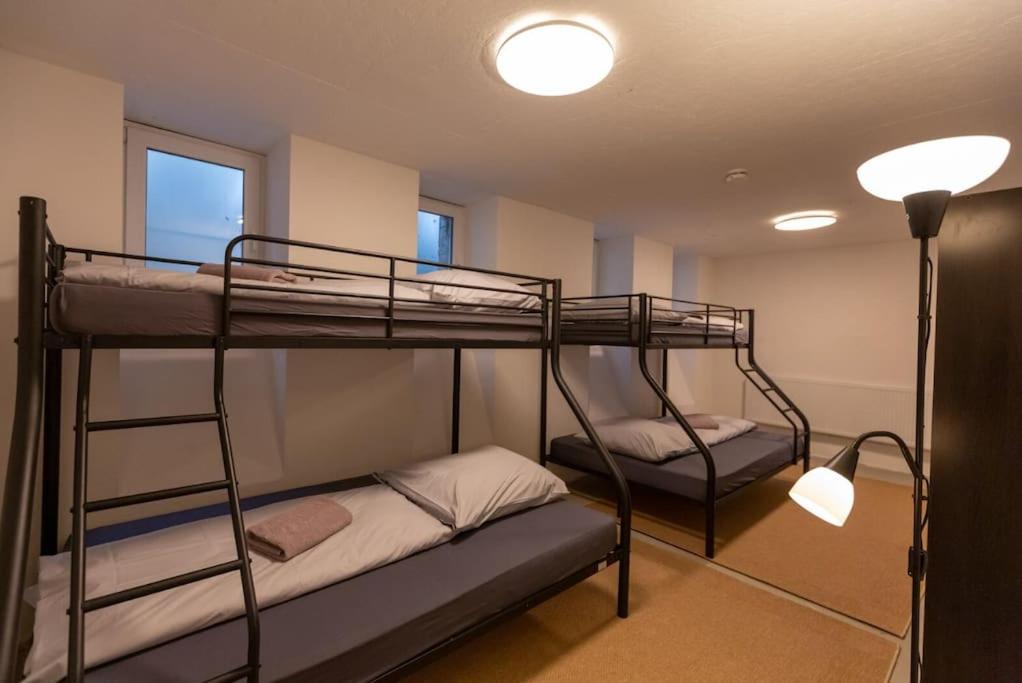 two bunk beds in a room with a lamp at Zwei Lofts in Kulturdenkmal nähe Zentrum (VI+V) in Leipzig