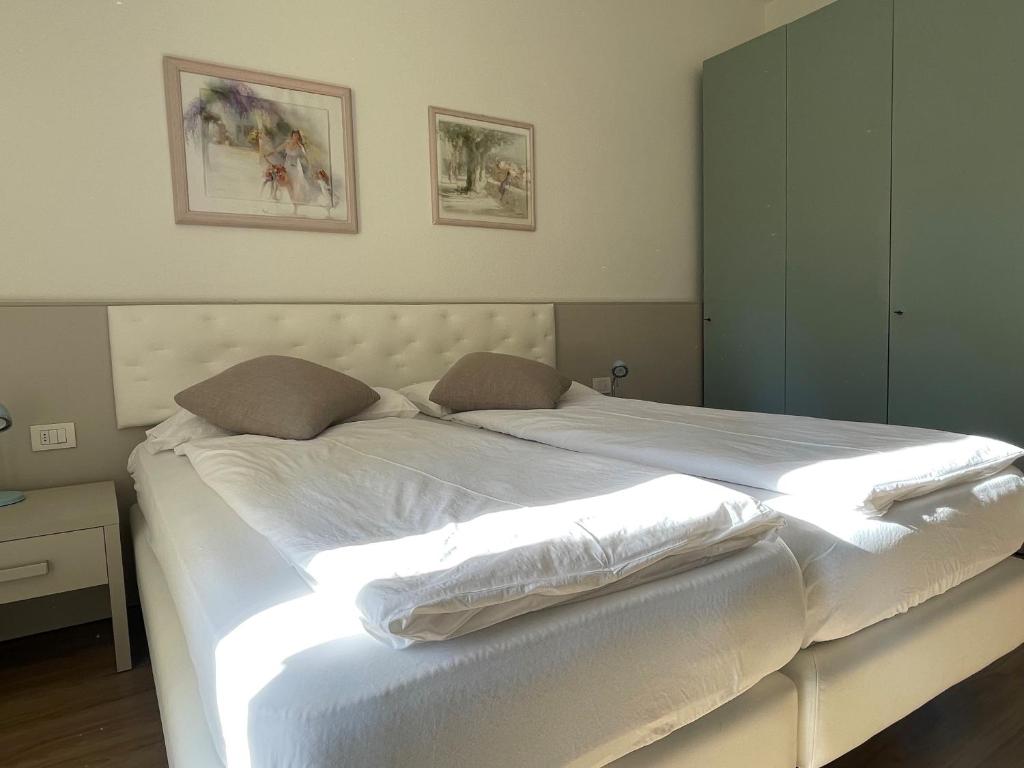 Postel nebo postele na pokoji v ubytování Hotel Garden Arco