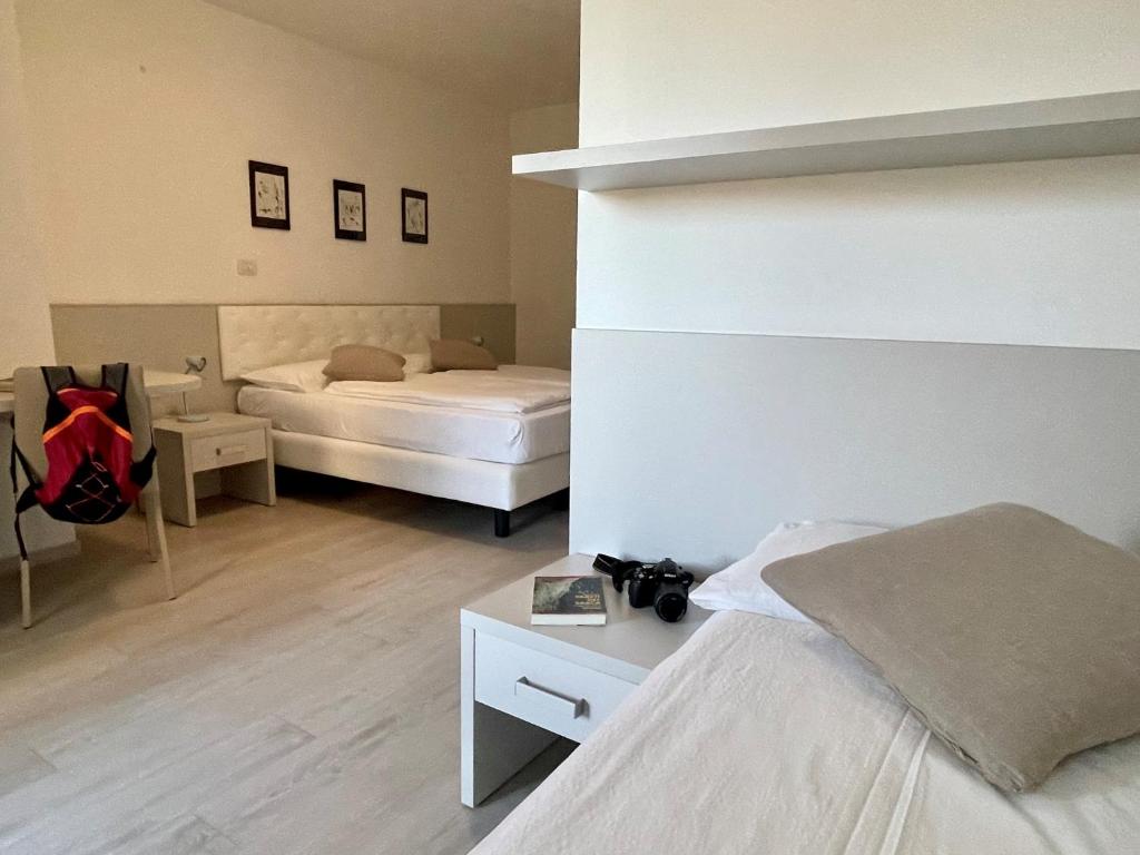 Postel nebo postele na pokoji v ubytování Hotel Garden Arco