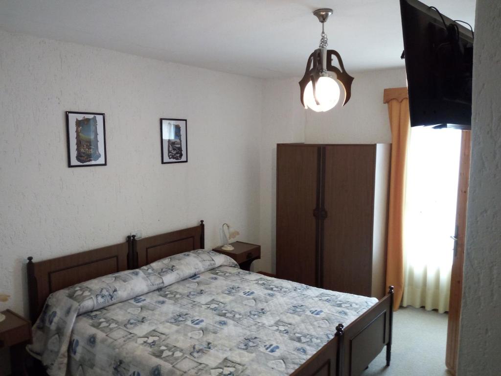 Postel nebo postele na pokoji v ubytování Albergo Al Pino