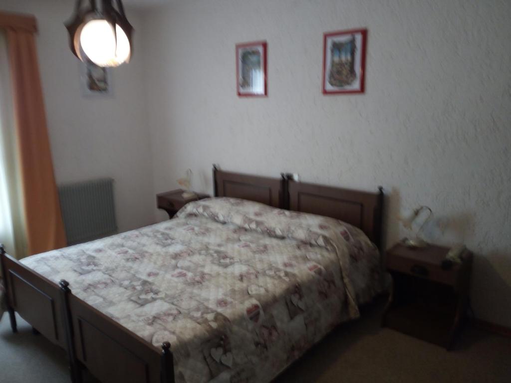 Postel nebo postele na pokoji v ubytování Albergo Al Pino