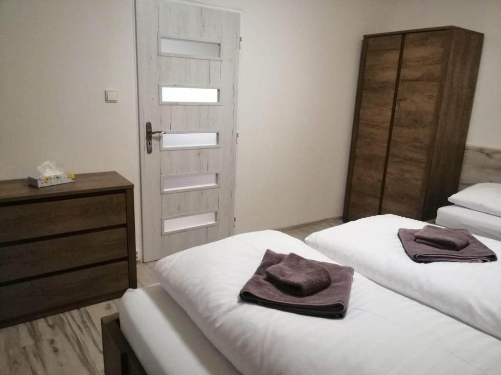 Postel nebo postele na pokoji v ubytování Apartmán West