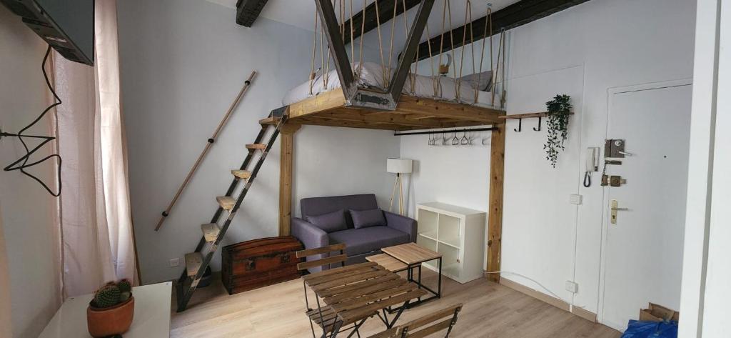 a living room with a couch and a loft at Studio au coeur de Marseille in Marseille