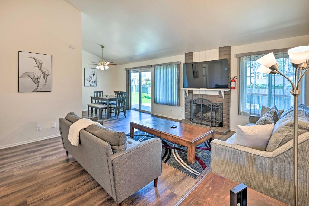 a living room with two couches and a table at Family-Friendly Oceanside Home 5 Mi to Beach in Oceanside