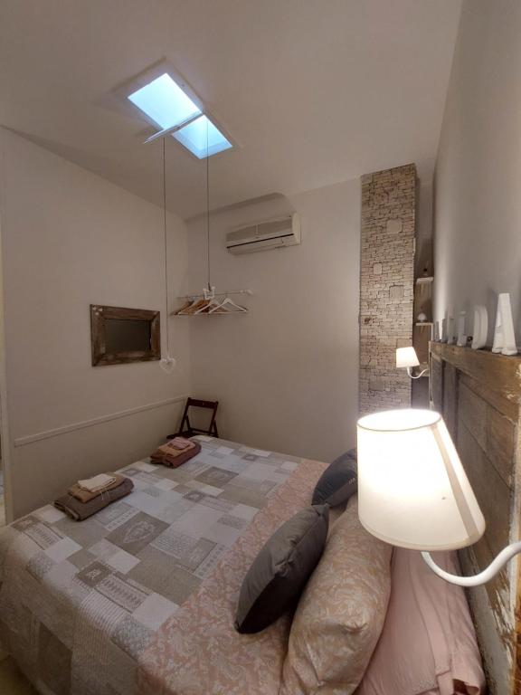 Postel nebo postele na pokoji v ubytování Mama Damì