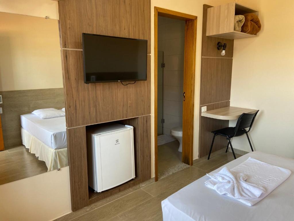 TV a/nebo společenská místnost v ubytování Kanoa Hotel