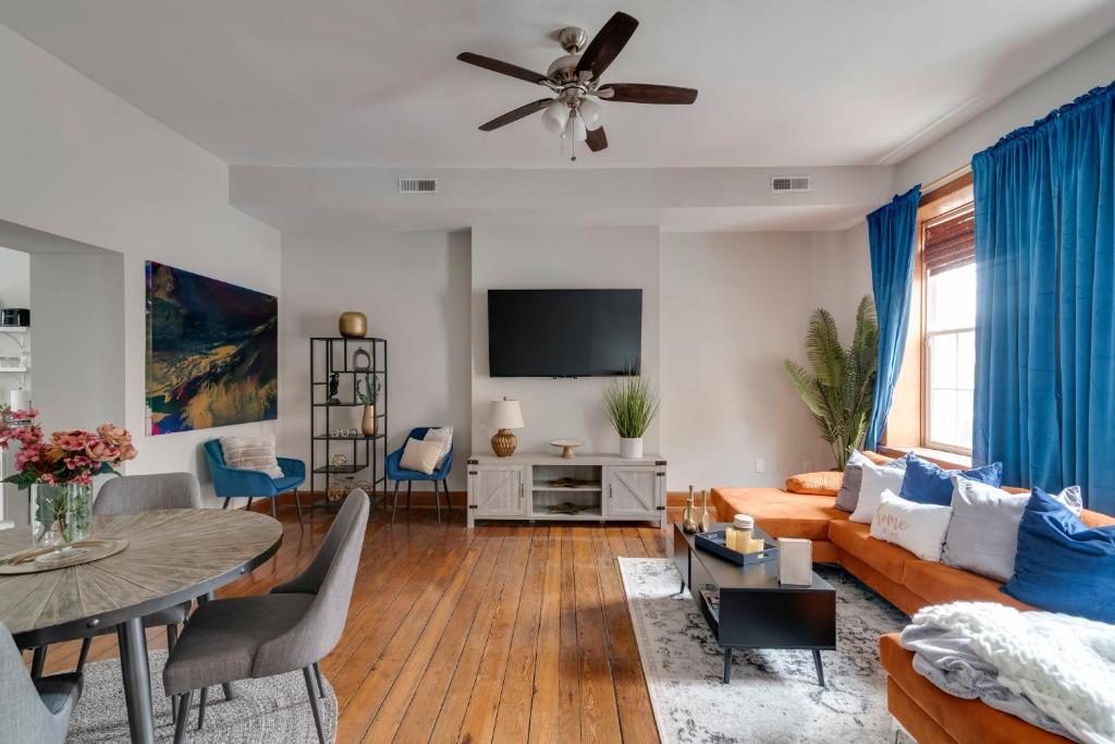 a living room with a couch and a table at Cozy Historic Family Home in the Heart of Richmond in Richmond