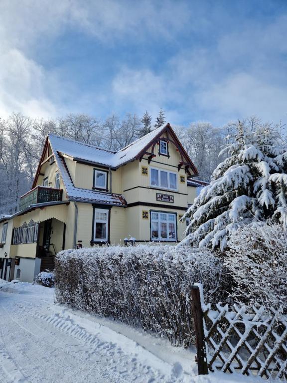 a house covered in snow with a fence at Haus Fessel - Helenenruh in Elend