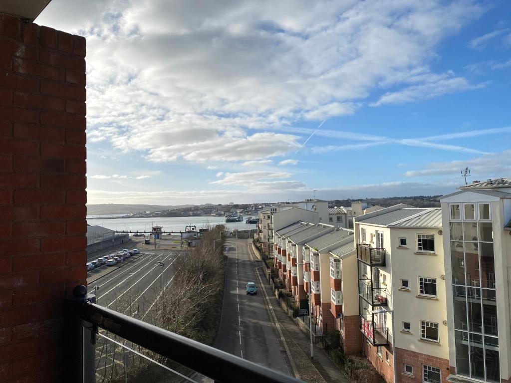 a view from a balcony of a street and buildings at Ferry Rd by Westcountry SA in Plymouth