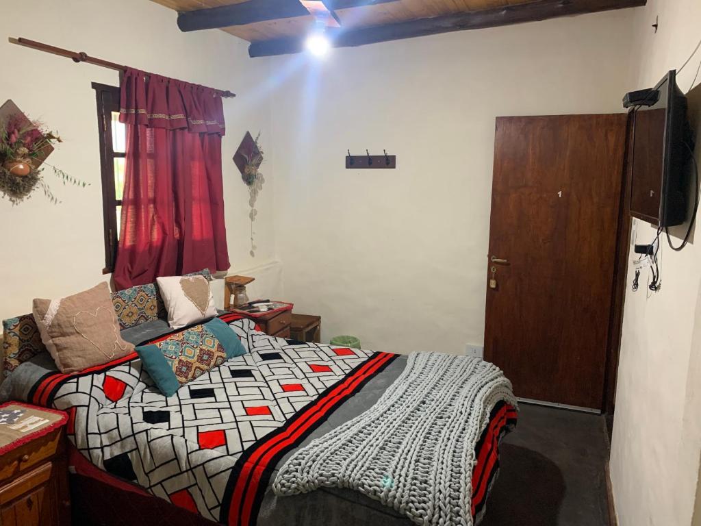 Postel nebo postele na pokoji v ubytování HOSTAL ISABELLA