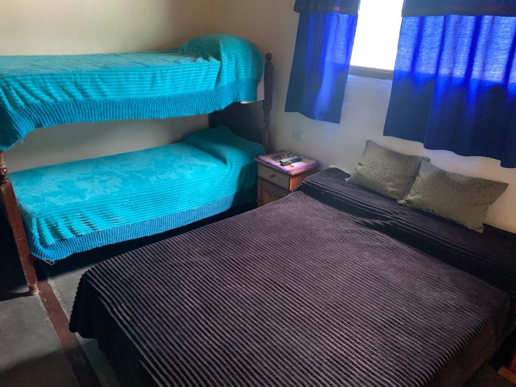 Postel nebo postele na pokoji v ubytování HOSTAL ISABELLA