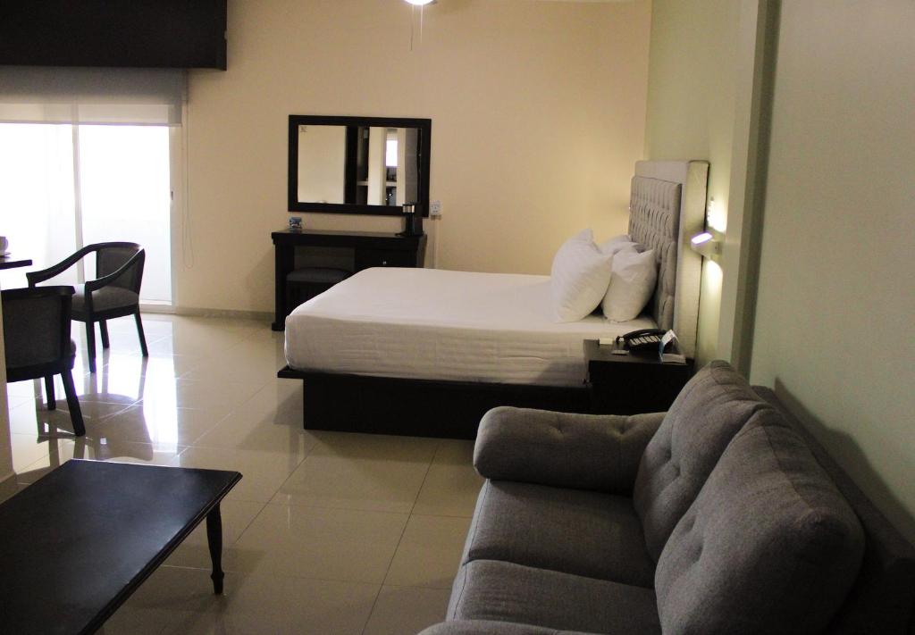 Postel nebo postele na pokoji v ubytování Hotel Mirage