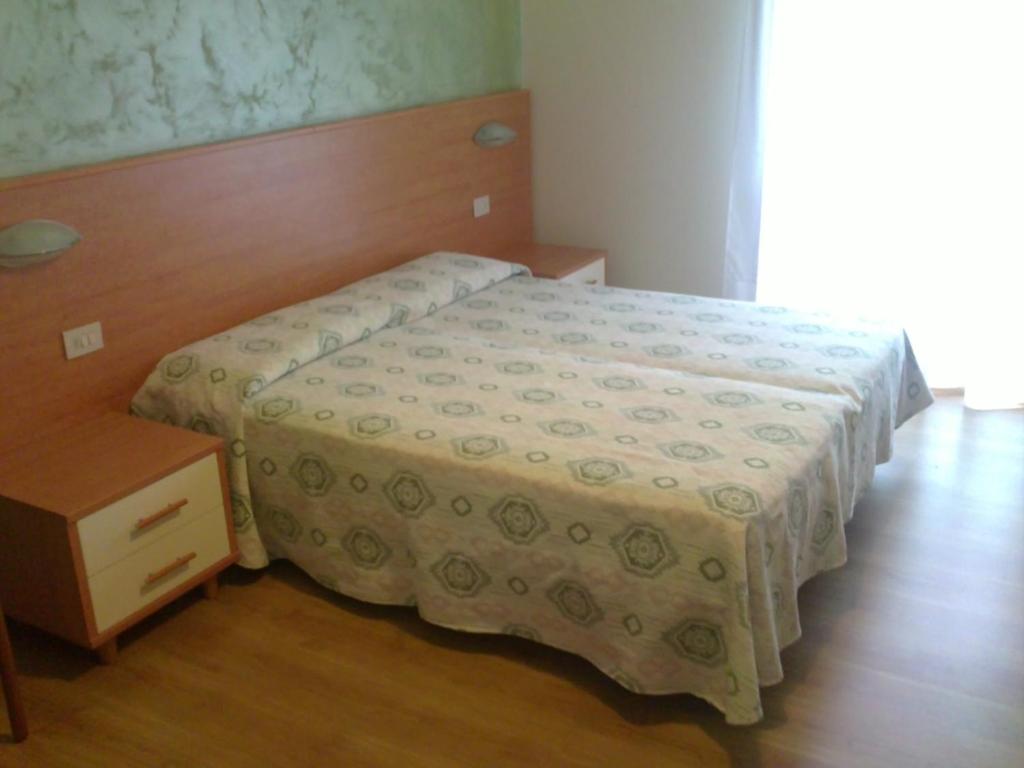 Postel nebo postele na pokoji v ubytování Hotel Rado