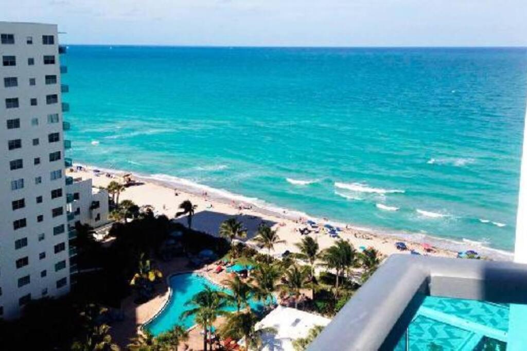 a view of the beach and the ocean from a building at Beautiful penthouse condo with stunning views of both ocean and city in Hollywood