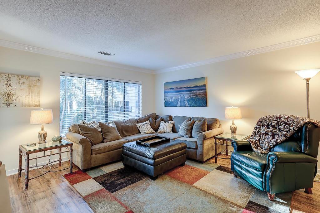 a living room with a couch and a chair at Springwood Villas 21 in Hilton Head Island