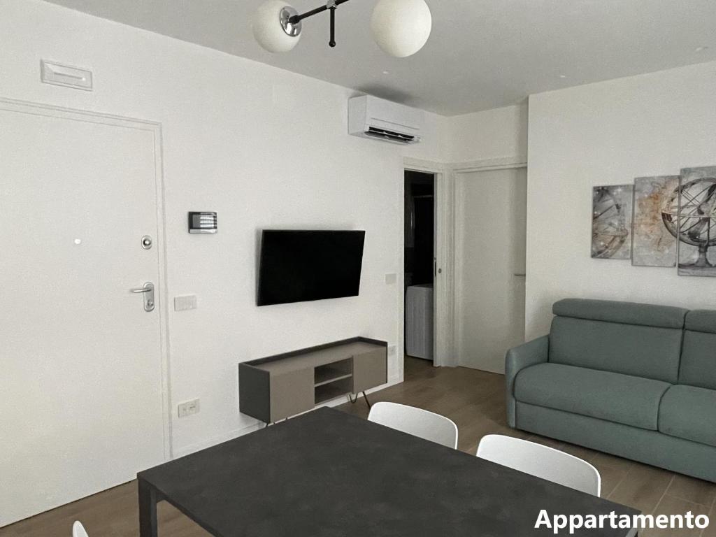 Televízia a/alebo spoločenská miestnosť v ubytovaní Casa di Cìì