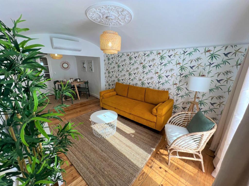 a living room with a couch and a table at Madre de Deus, 5 - Terrace in Évora