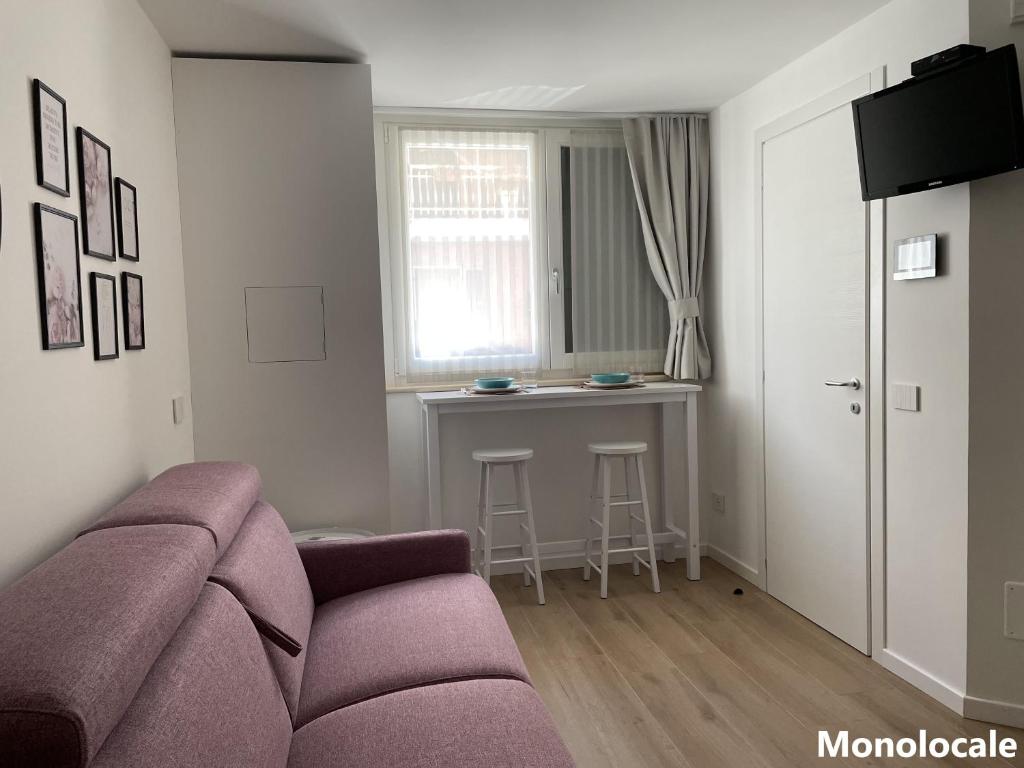Televízia a/alebo spoločenská miestnosť v ubytovaní Casa di Cìì