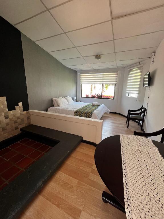 Postel nebo postele na pokoji v ubytování Hostería El Troje Experience
